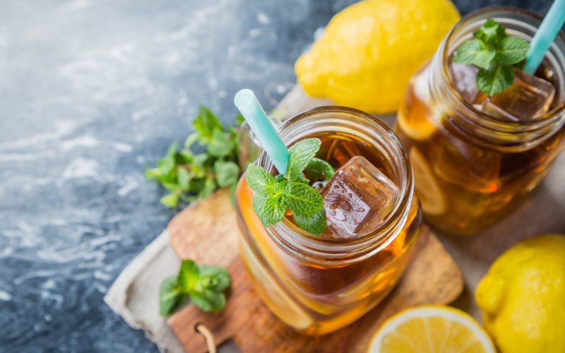 Iced tea in glass jars, copy space