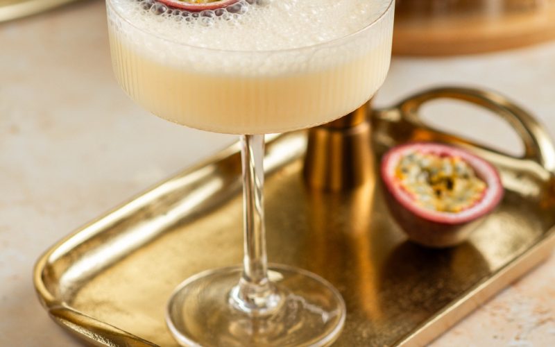 Passion fruit martini drink cocktail creamy aperitif with fresh fruit